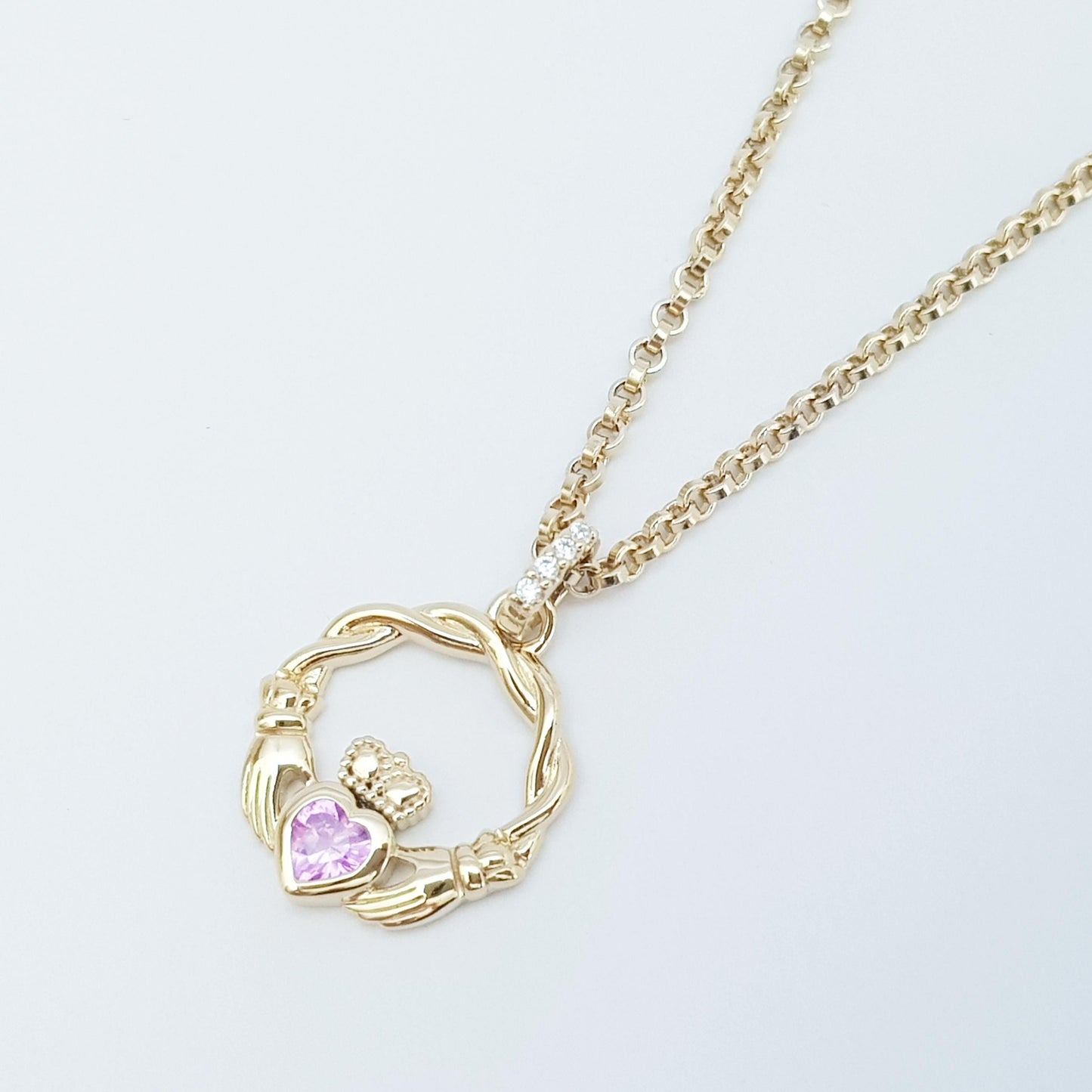Dainty Sterling Silver claddagh necklace set with sparkling Pink heart
