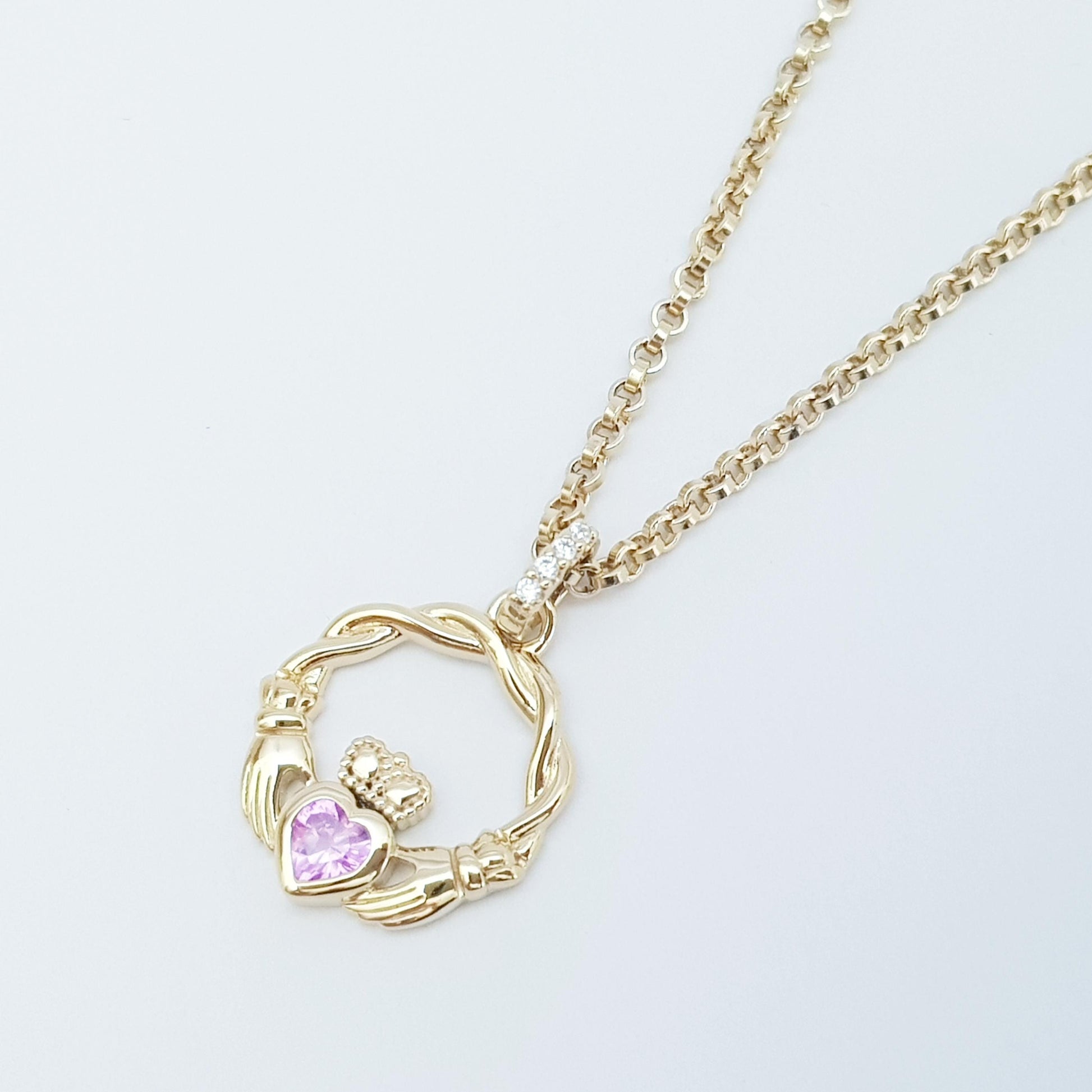 Dainty Sterling Silver claddagh necklace set with sparkling Pink heart