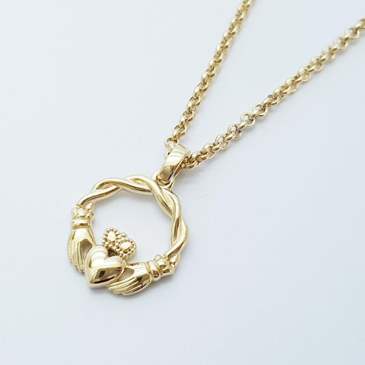 Small Sterling Silver claddagh necklace with gold plating and celtic braid.