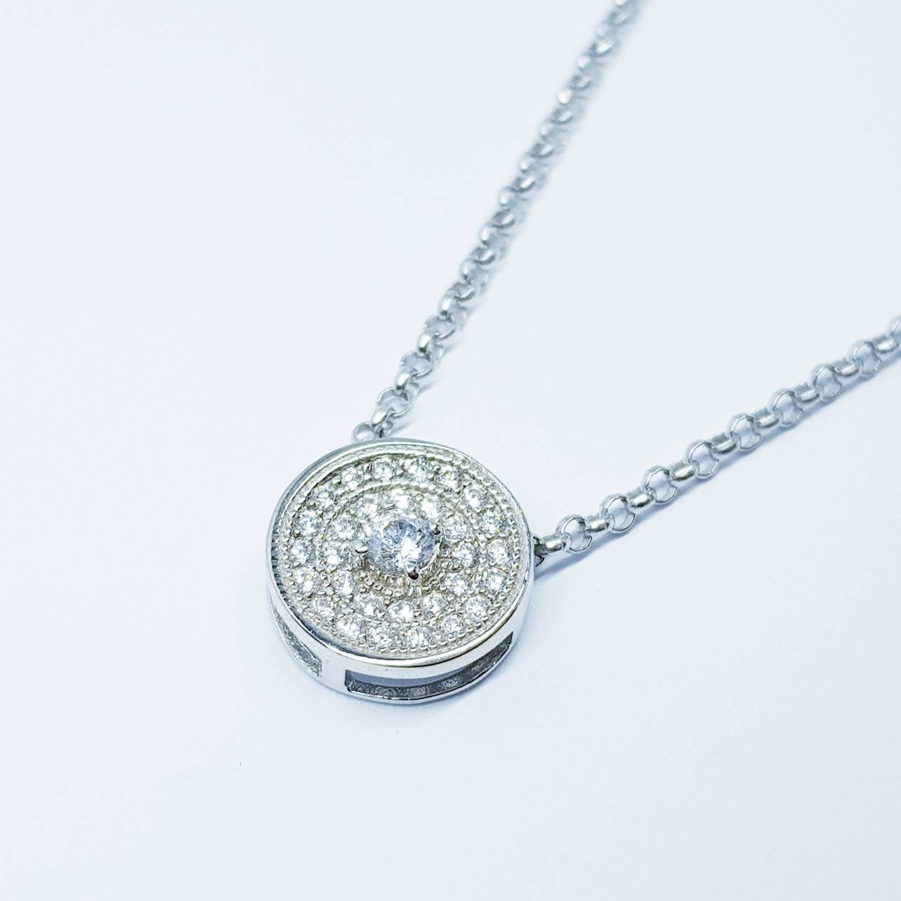 Dainty round necklace floating on sterling silver chain