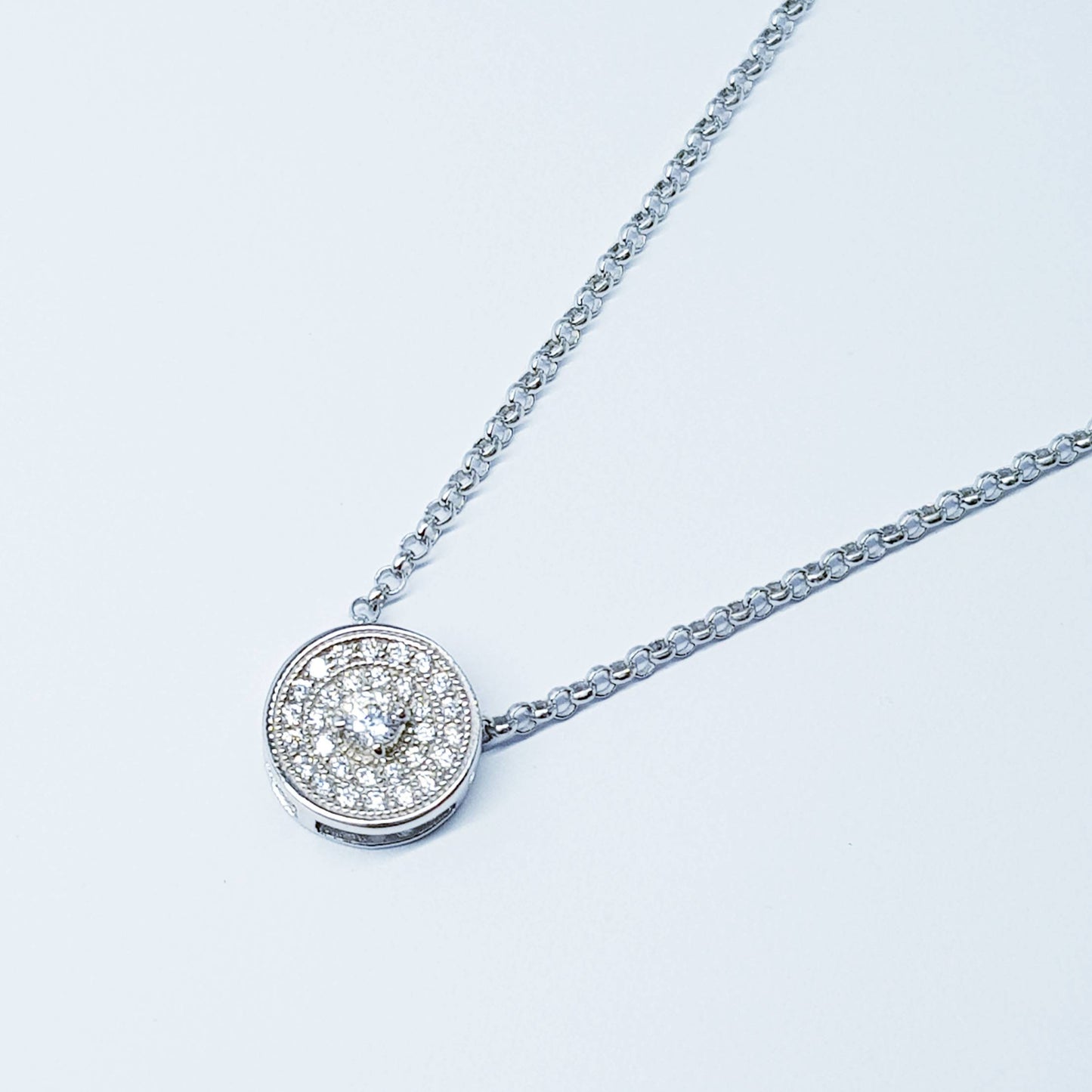 Dainty round necklace floating on sterling silver chain