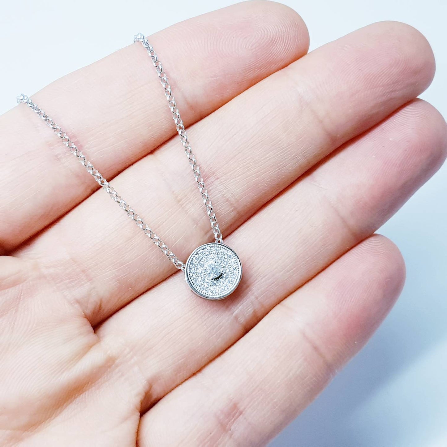 Dainty round necklace floating on sterling silver chain