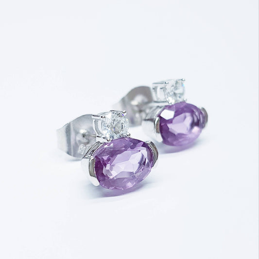 Small sterling silver studs set with purple and white cubic zirconia, sideways oval amethyst