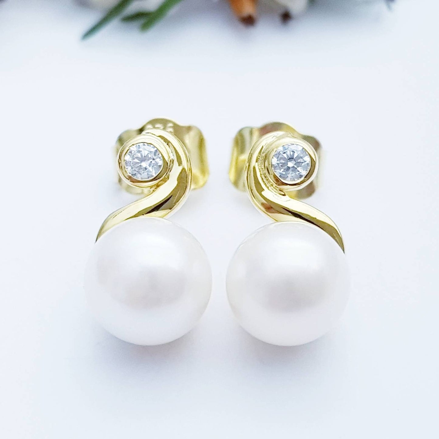 Gold plated sterling silver stud earrings with freshwater pearl