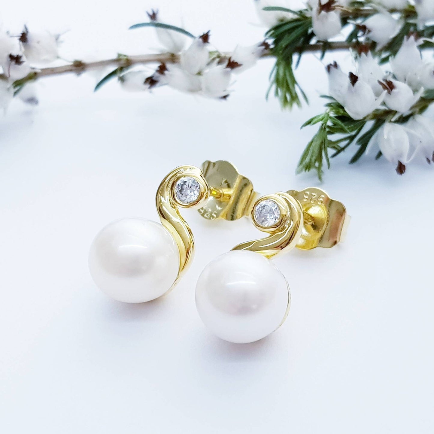 Gold plated sterling silver stud earrings with freshwater pearl