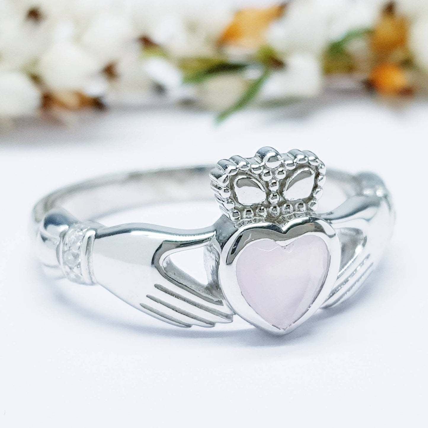 Irish Claddagh ring set with pink heart shaped stone from Galway, Ireland