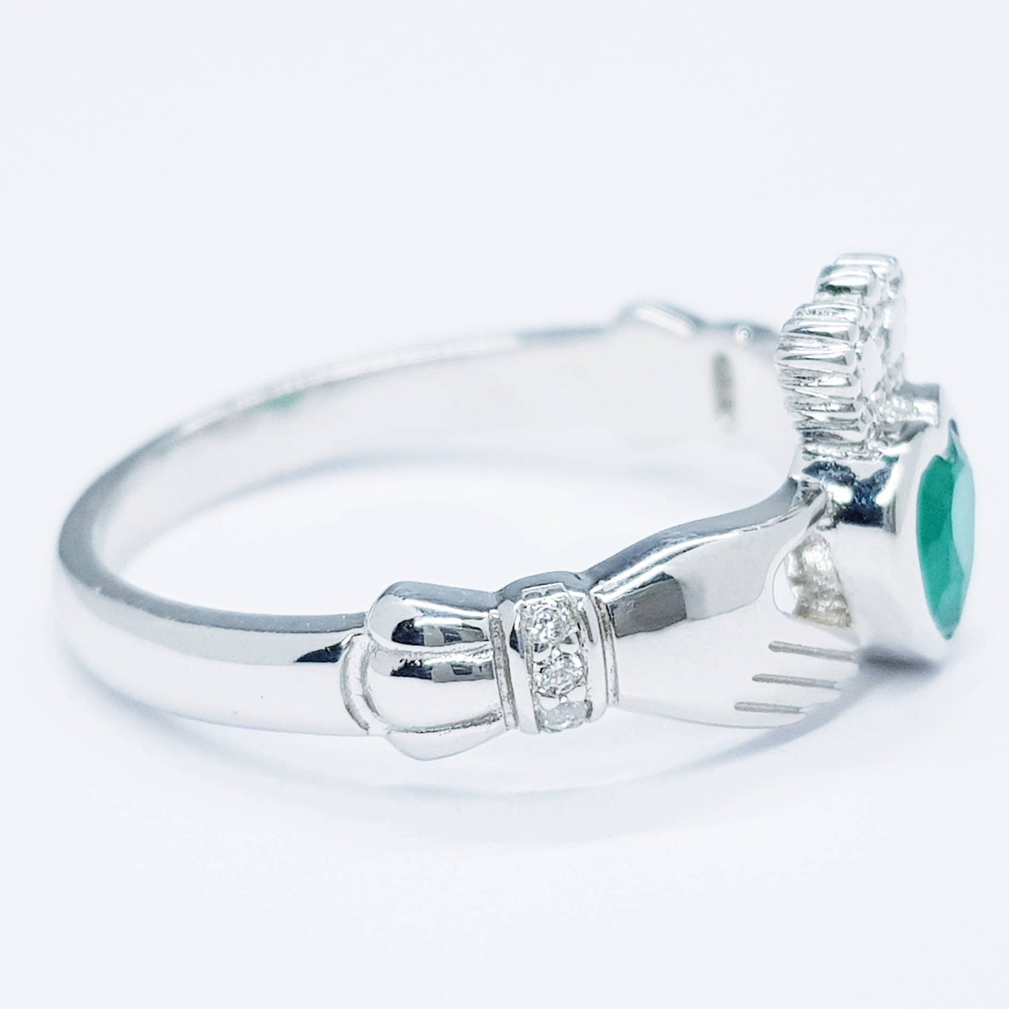 Sterling Silver Claddagh ring set with emerald green heart shaped stone, may birthstone claddagh ring from Ireland