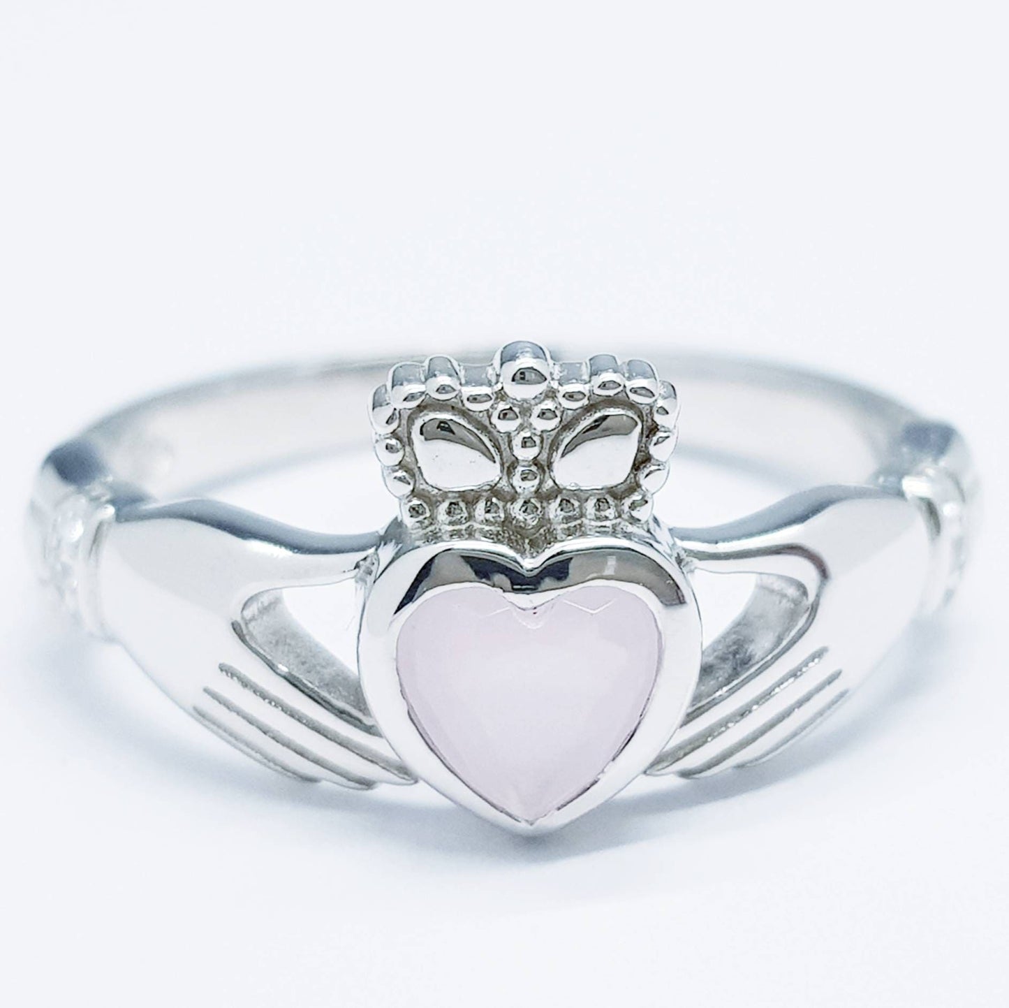 Irish Claddagh ring set with pink heart shaped stone from Galway, Ireland