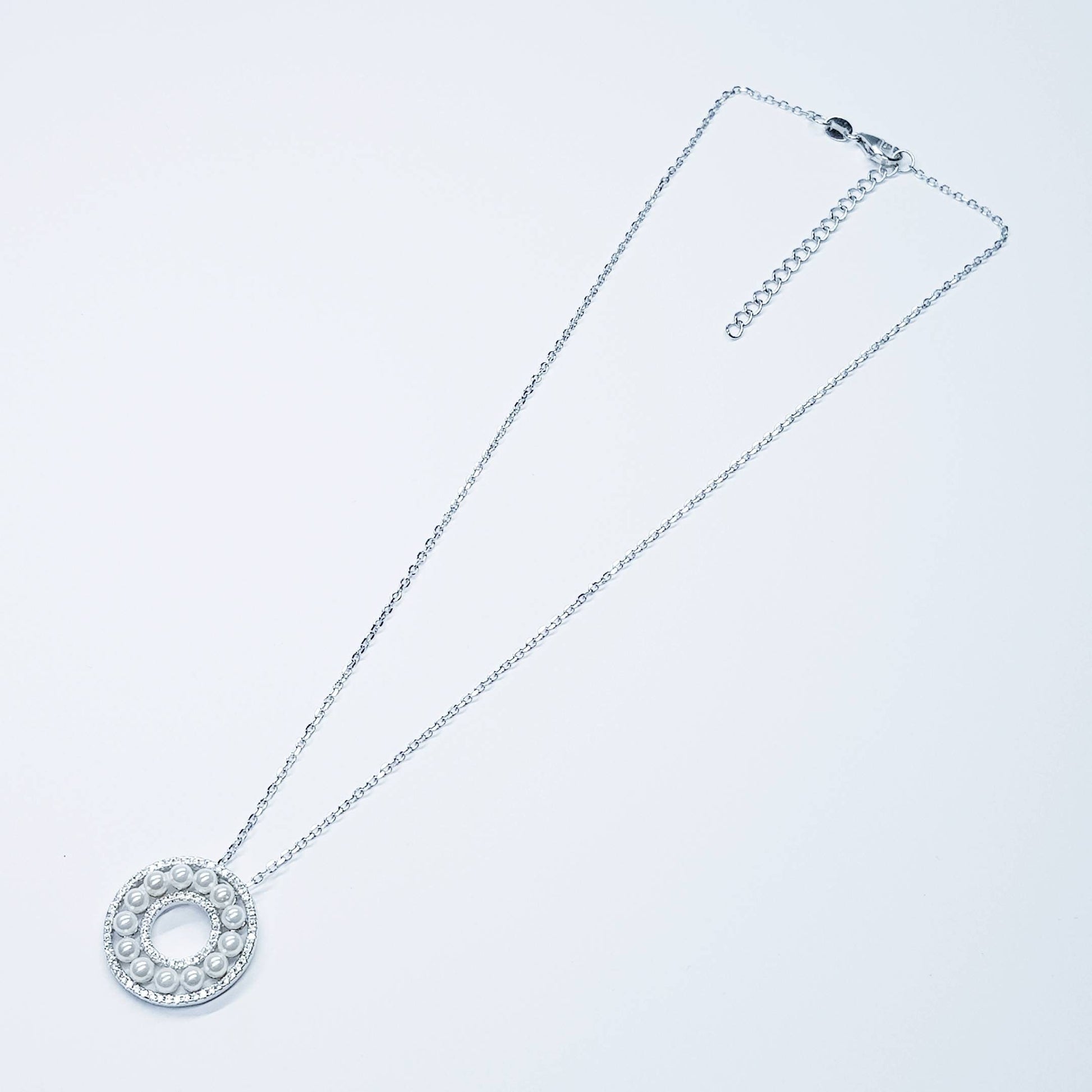 Elegant pearl pendant set in silver with sparkling white cubic zirconia, pearl circle necklace