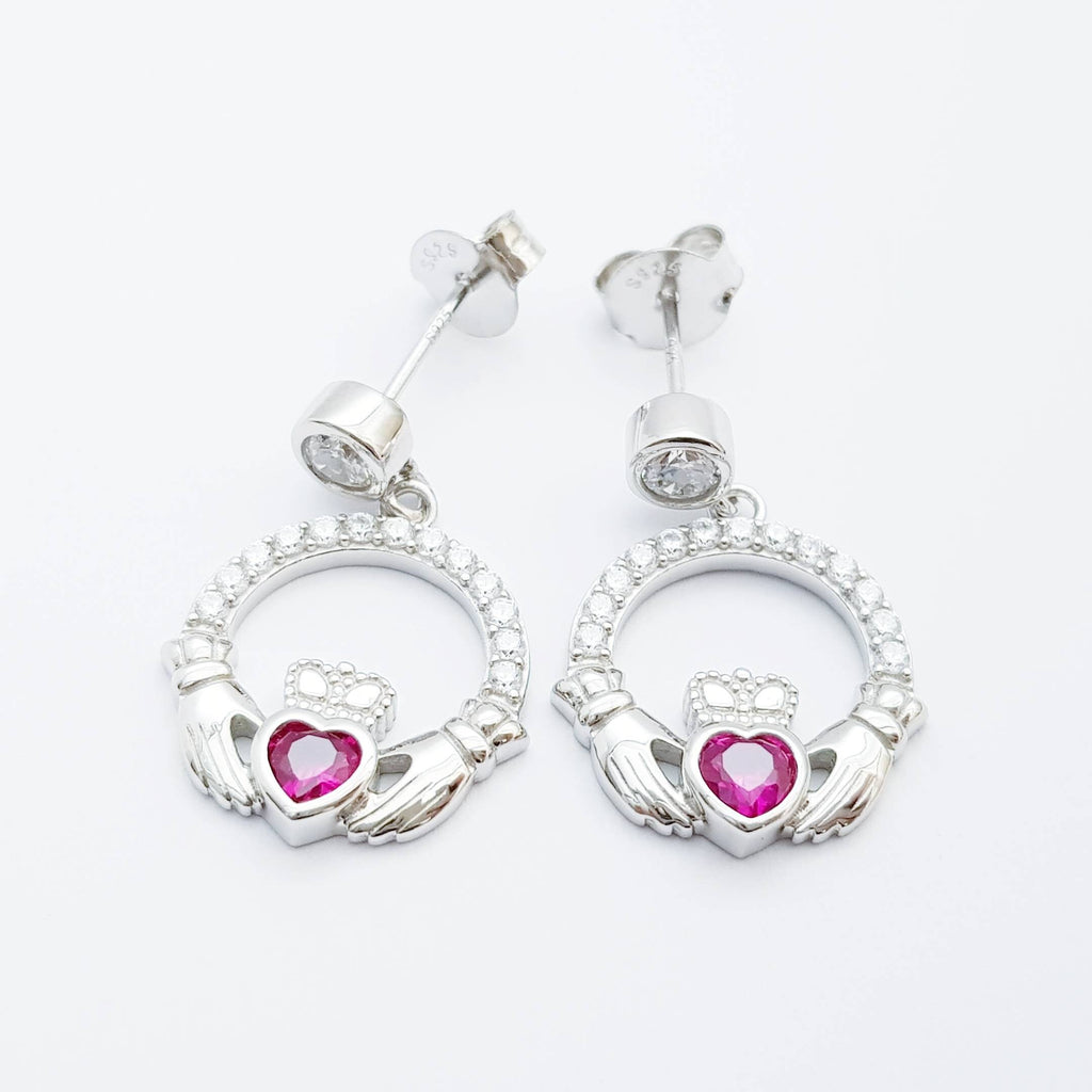 Silver claddagh drop earrings with red stone heart, July birthstone