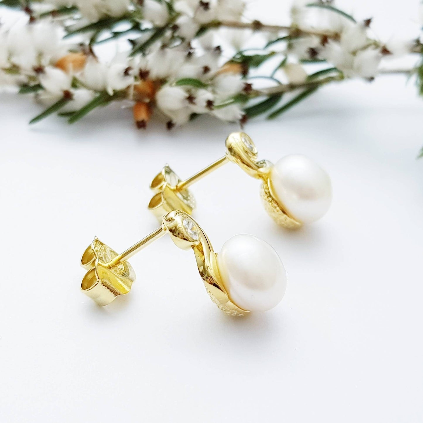 Gold plated sterling silver stud earrings with freshwater pearl