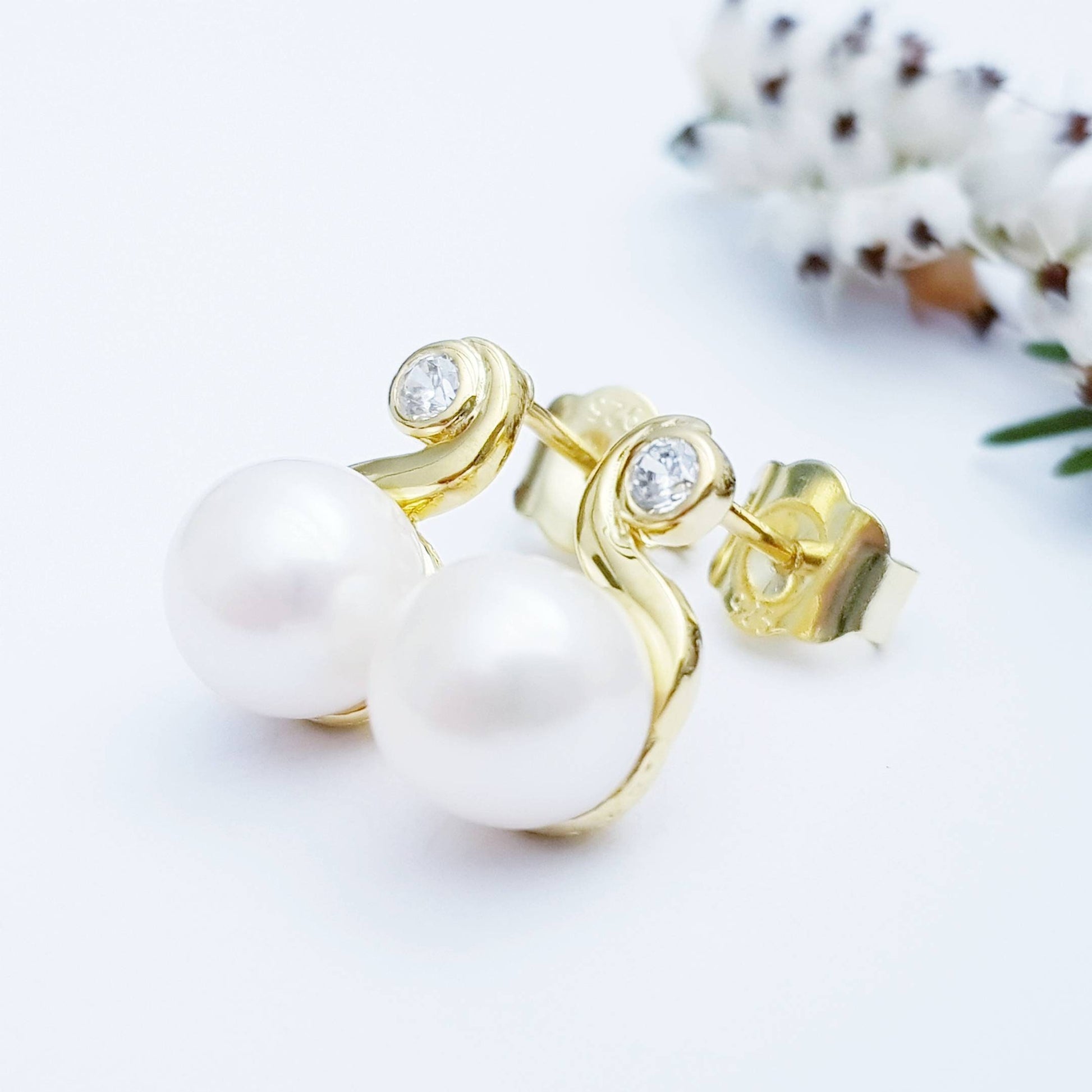 Gold plated sterling silver stud earrings with freshwater pearl