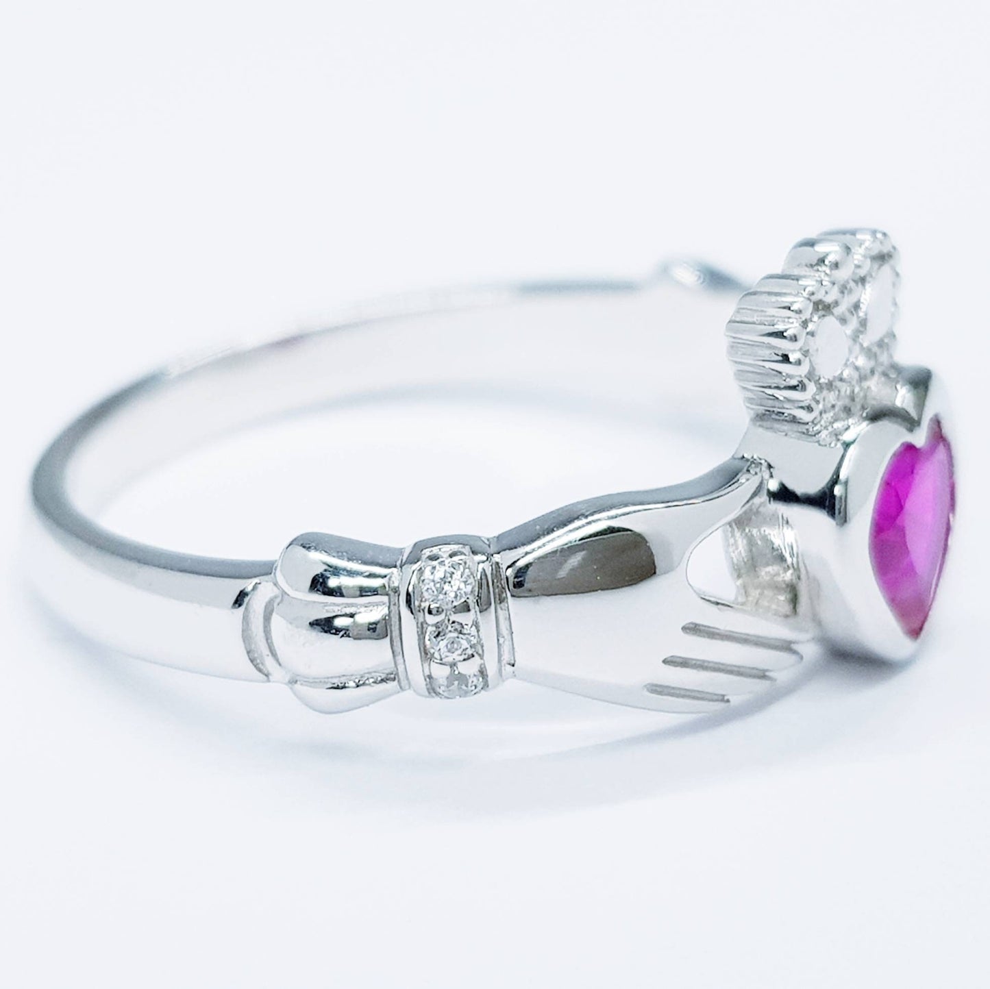 Sterling Silver Claddagh ring set with ruby red heart shaped stone, July birthstone claddagh ring