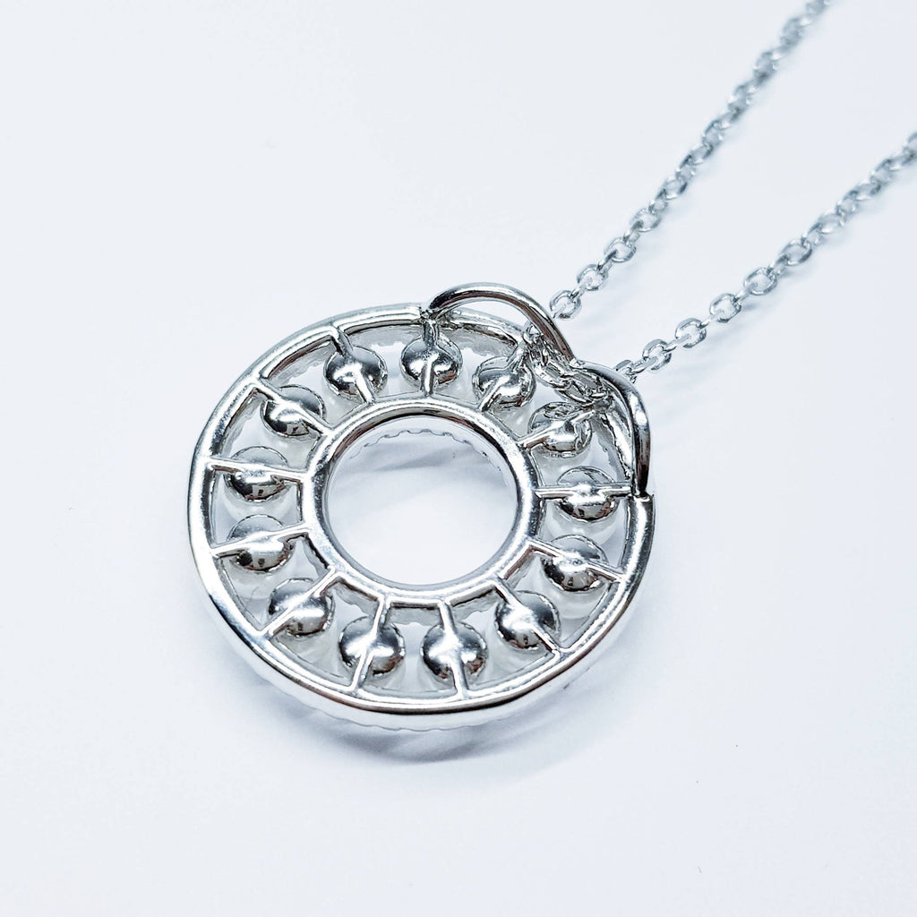 Elegant pearl pendant set in silver with sparkling white cubic zirconia, pearl circle necklace