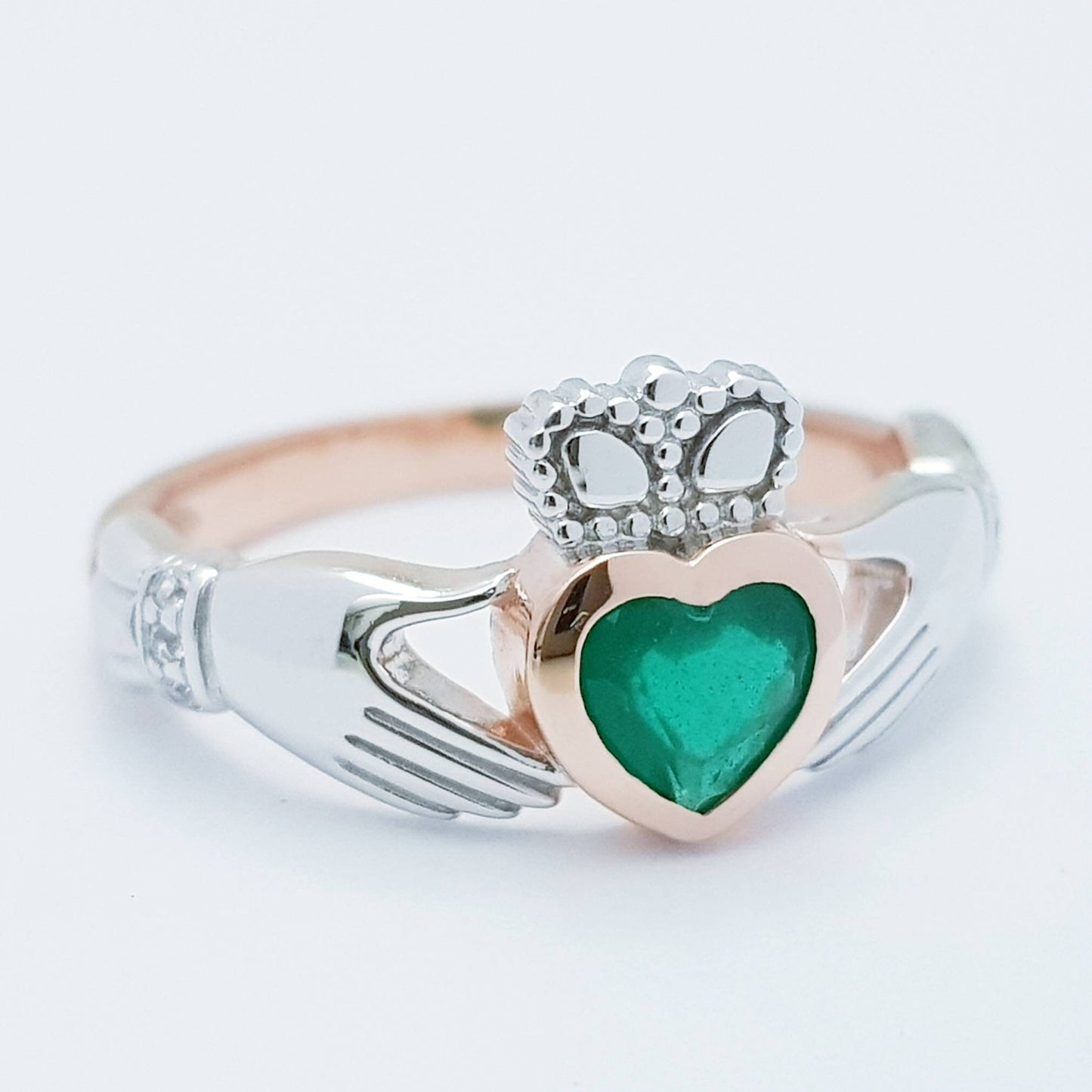 Sterling Silver Rose Gold plated Claddagh ring set with emerald green stone, heart and hands ring