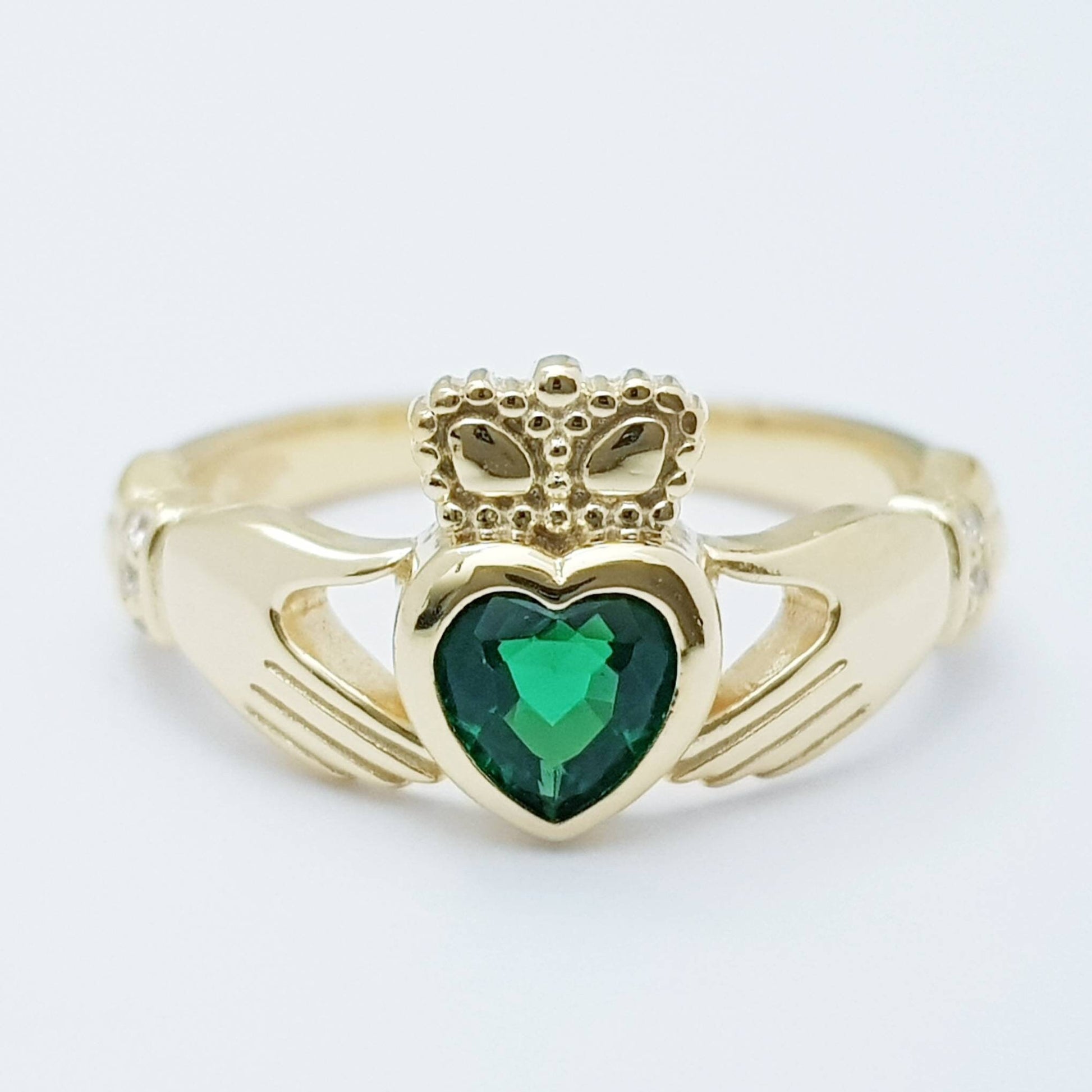Sterling Silver Yellow Gold plated Claddagh ring set with emerald green heart shaped stone, may birthstone claddagh ring from Ireland