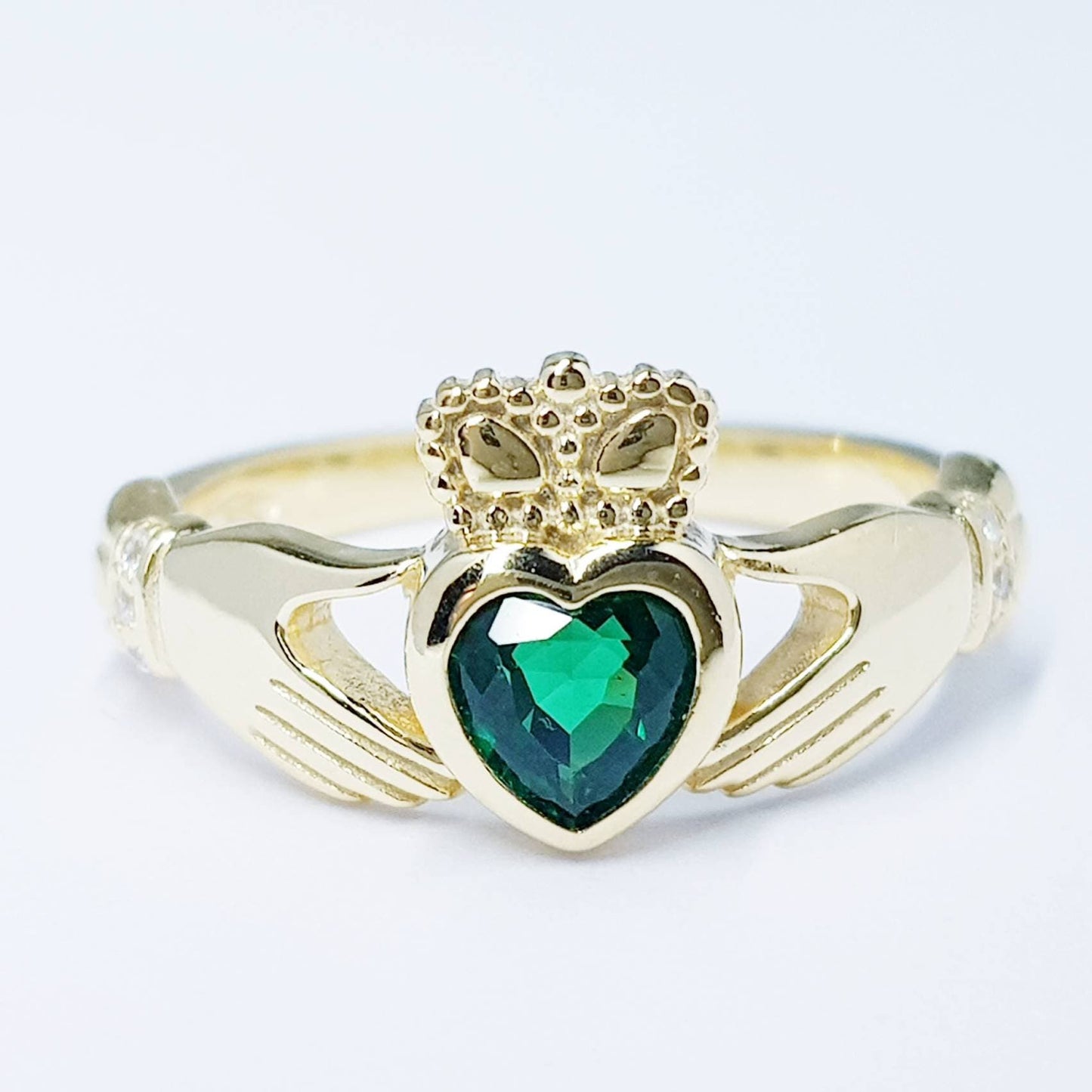 Sterling Silver Yellow Gold plated Claddagh ring set with emerald green heart shaped stone, may birthstone claddagh ring from Ireland