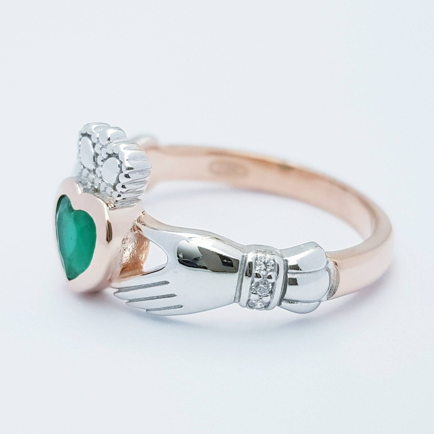 Sterling Silver Rose Gold plated Claddagh ring set with emerald green stone, heart and hands ring
