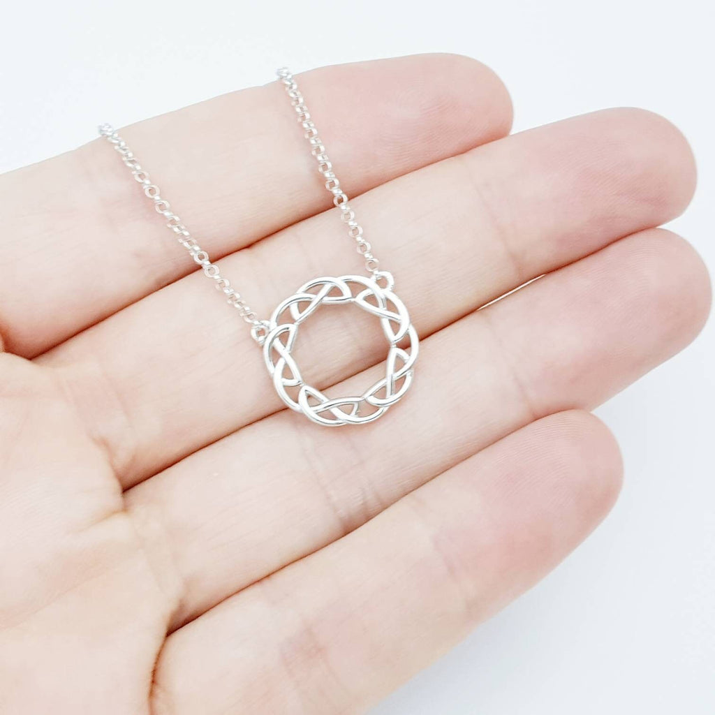 Double sided celtic knot pendant, silver round celtic necklace made in Ireland with angel wing chain