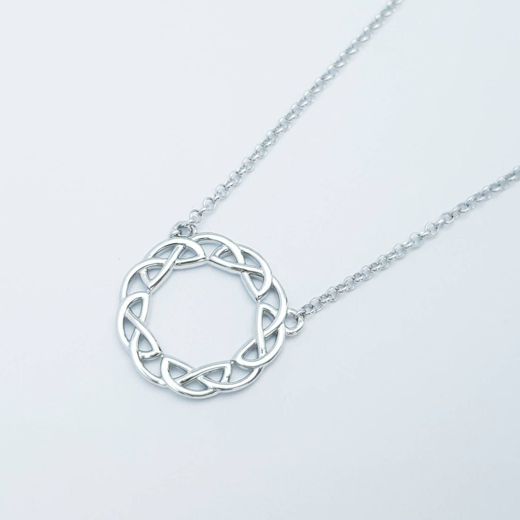 Double sided celtic knot pendant, silver round celtic necklace made in Ireland with angel wing chain