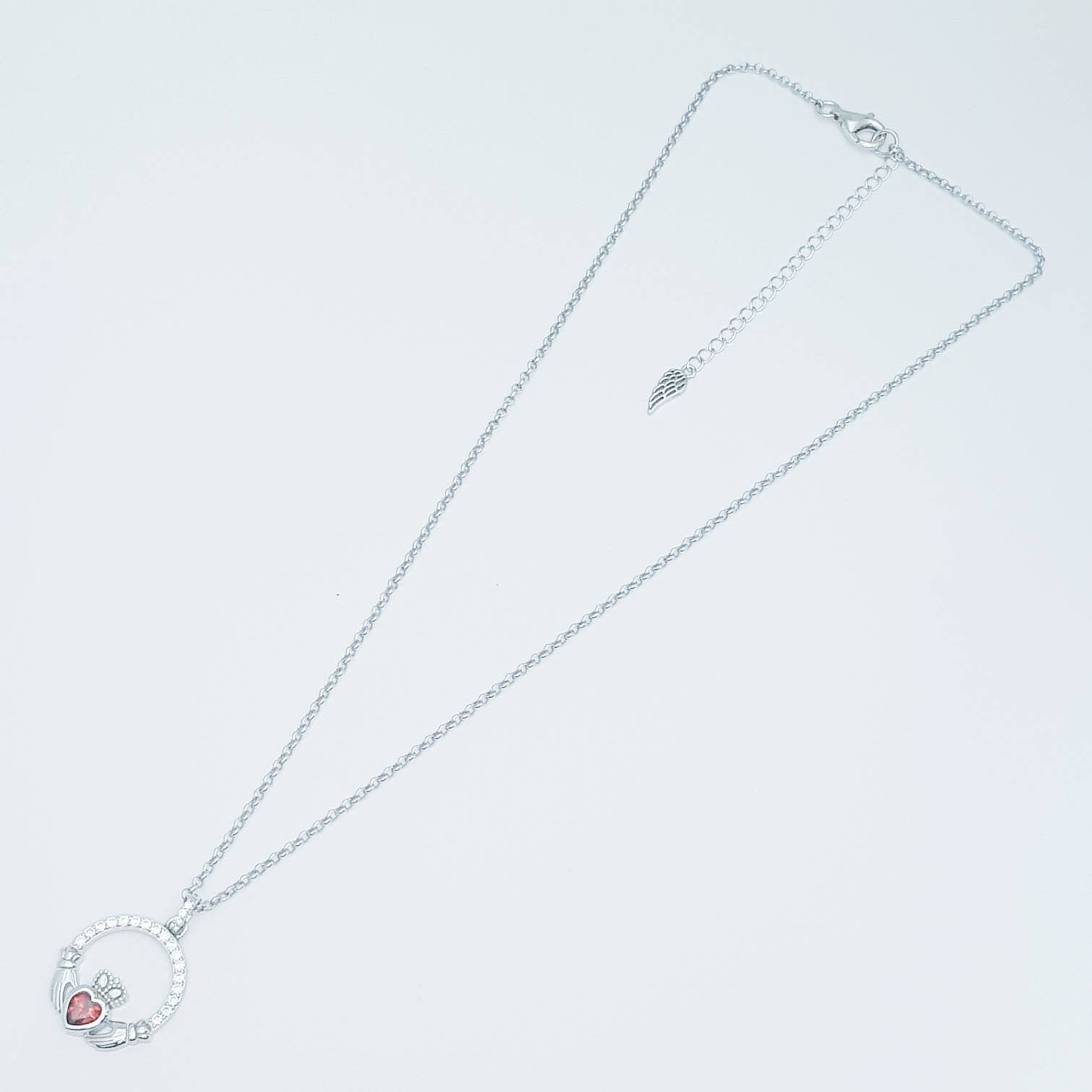 Sterling silver claddagh necklace  with red garnet heart shaped stone, January birthstone