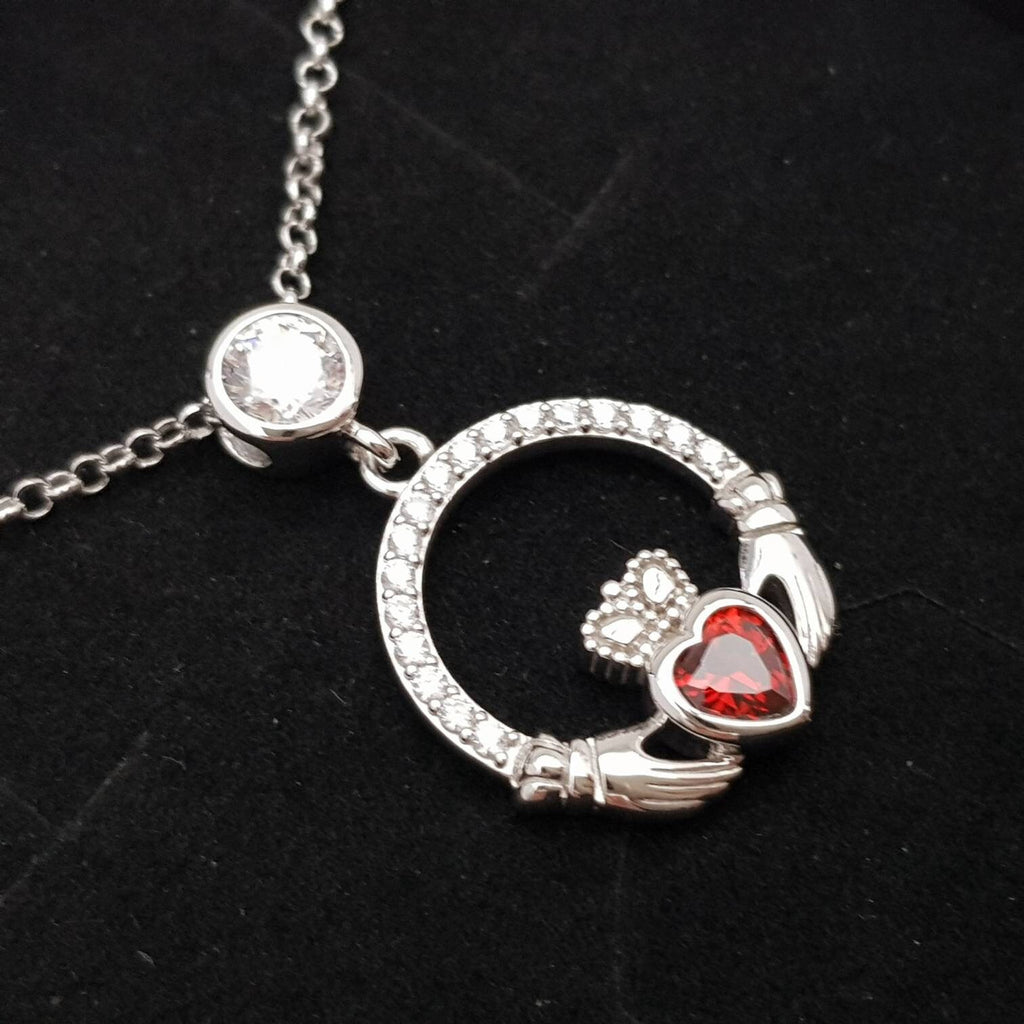 Sterling silver claddagh necklace  with red garnet heart shaped stone, January birthstone