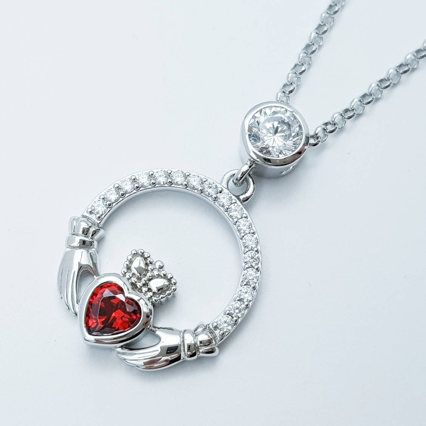 Sterling silver claddagh necklace  with red garnet heart shaped stone, January birthstone