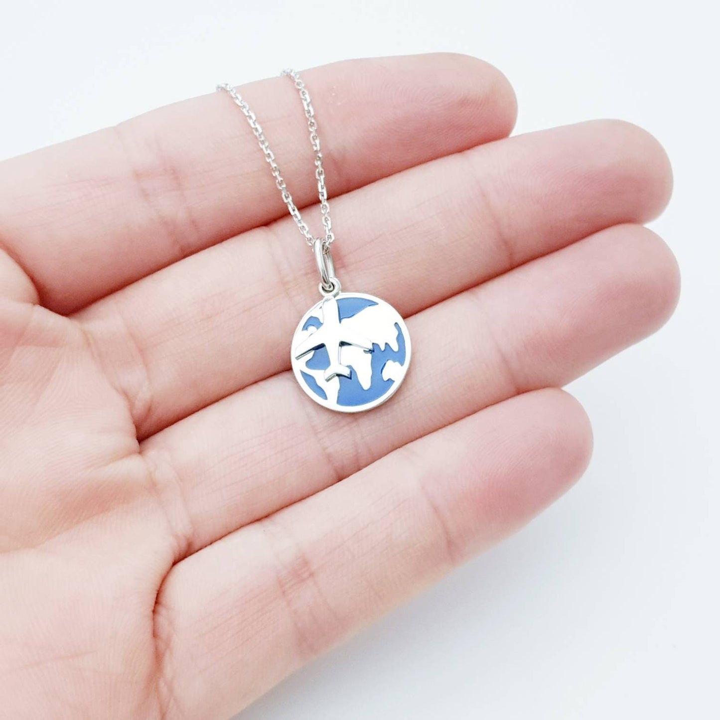 Travel pendant with enameled blue world pendant and airplane charm, Wanderlust necklace, gift for traveller