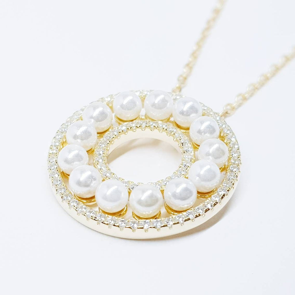 Elegant pearl pendant set in silver with sparkling white cubic zirconia, pearl circle necklace