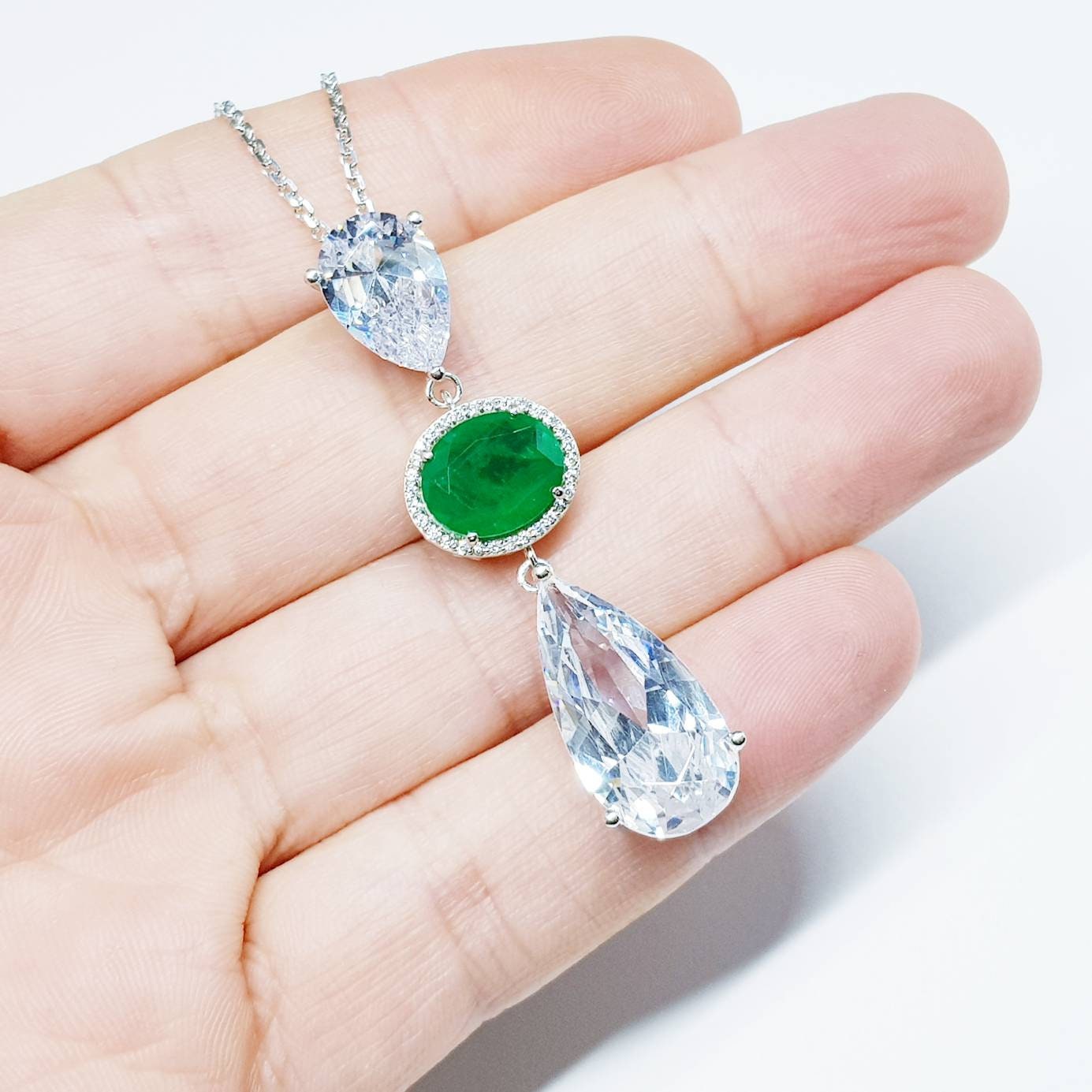 Exceptional large teardrop necklace with oval emerald green cubic zirconia