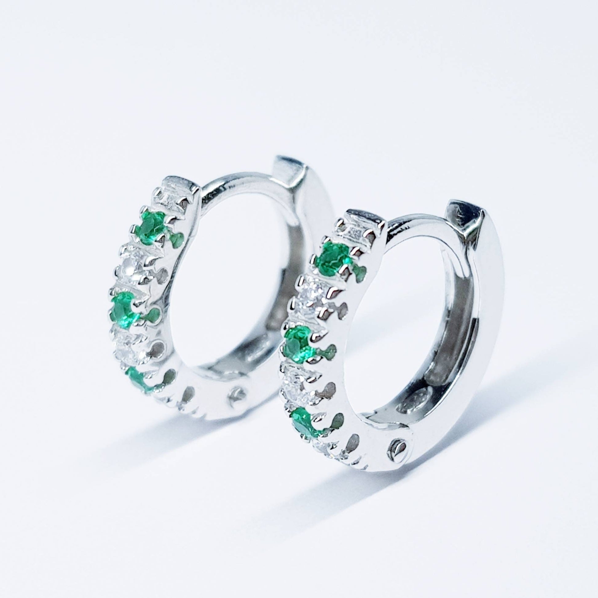 Small silver hoops with green and white CZs, mini hoop earrings, second hole huggies
