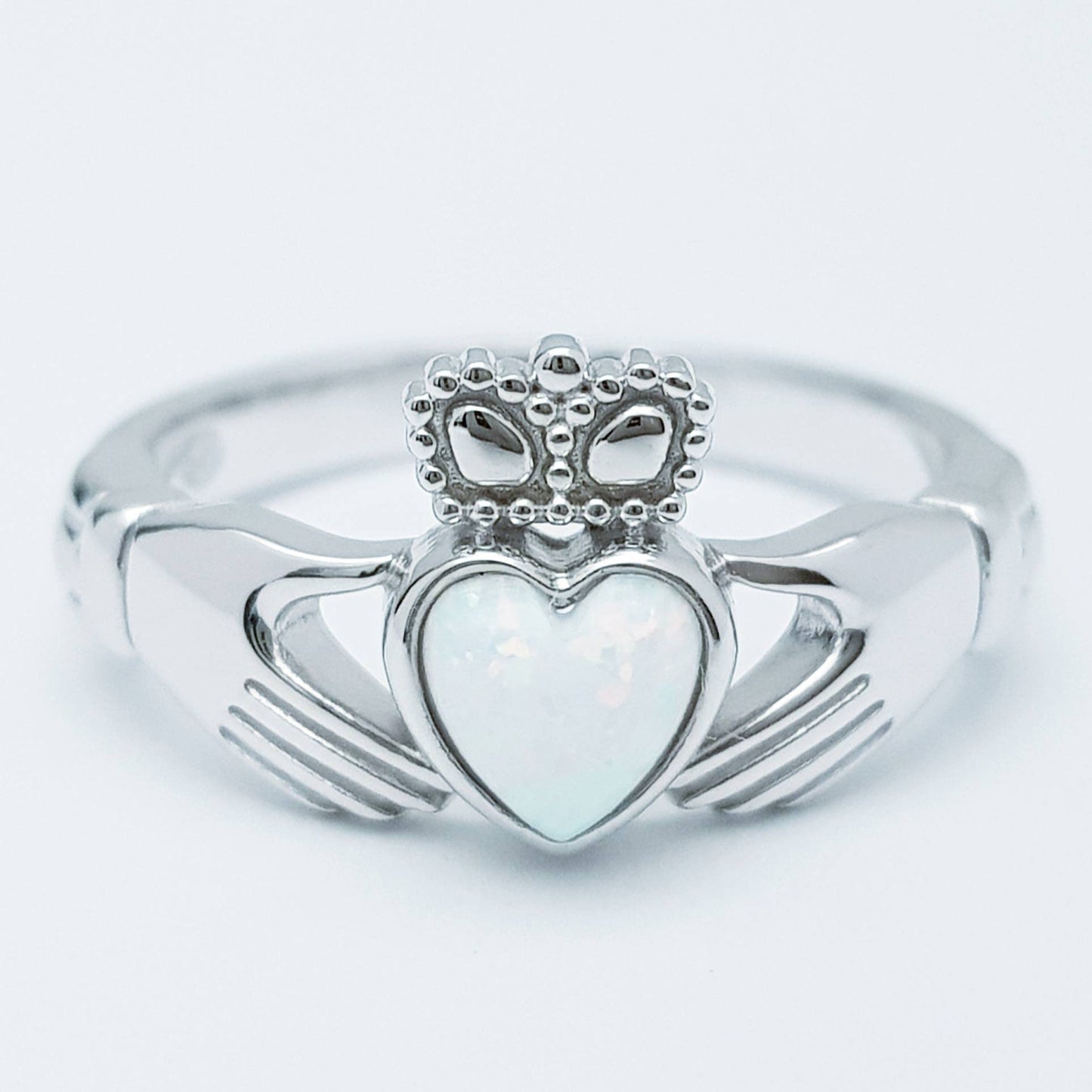 Sterling Silver Claddagh ring set with white opal heart, October birthstone