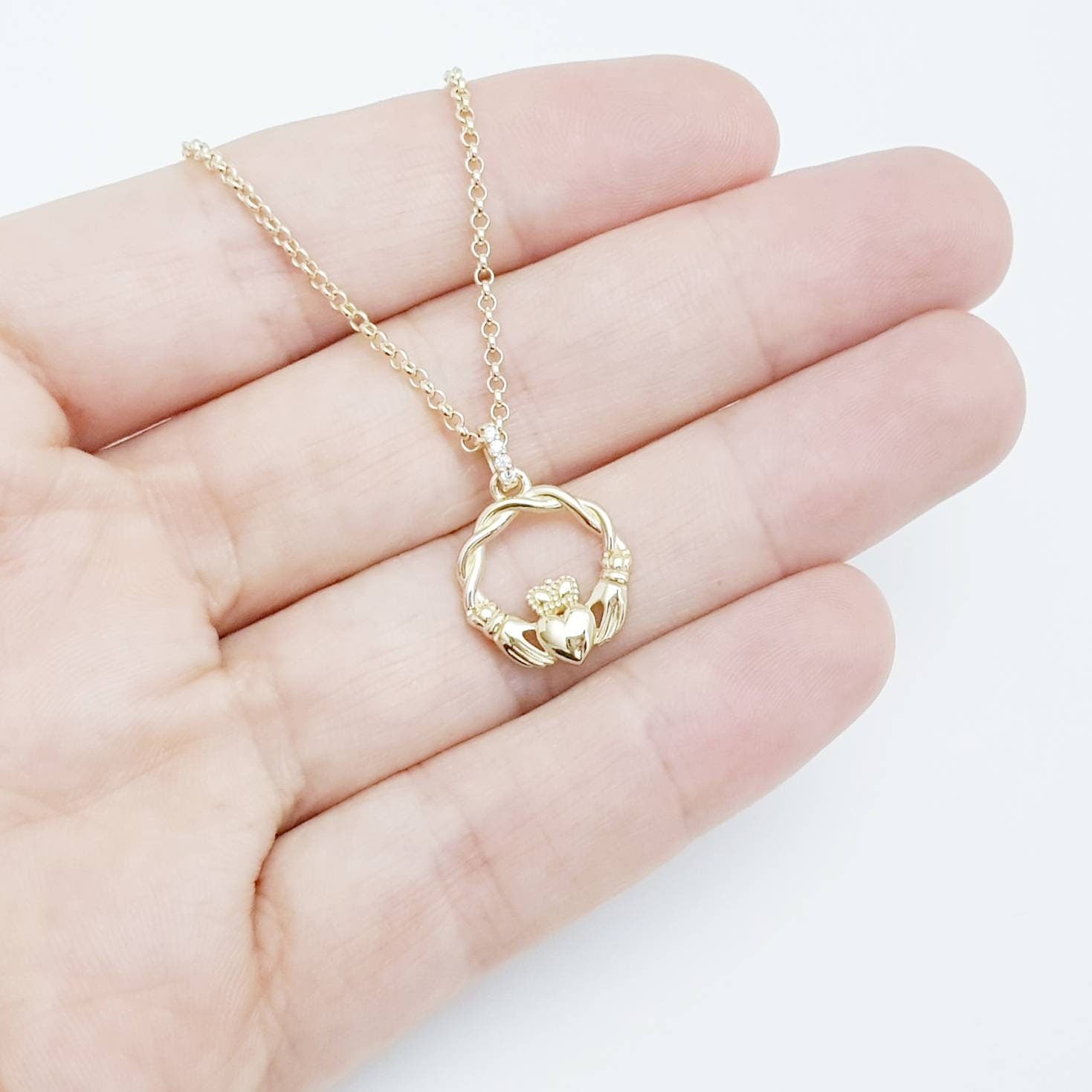 Dainty Sterling Silver claddagh necklace with gold plating and intertwined celtic braid.